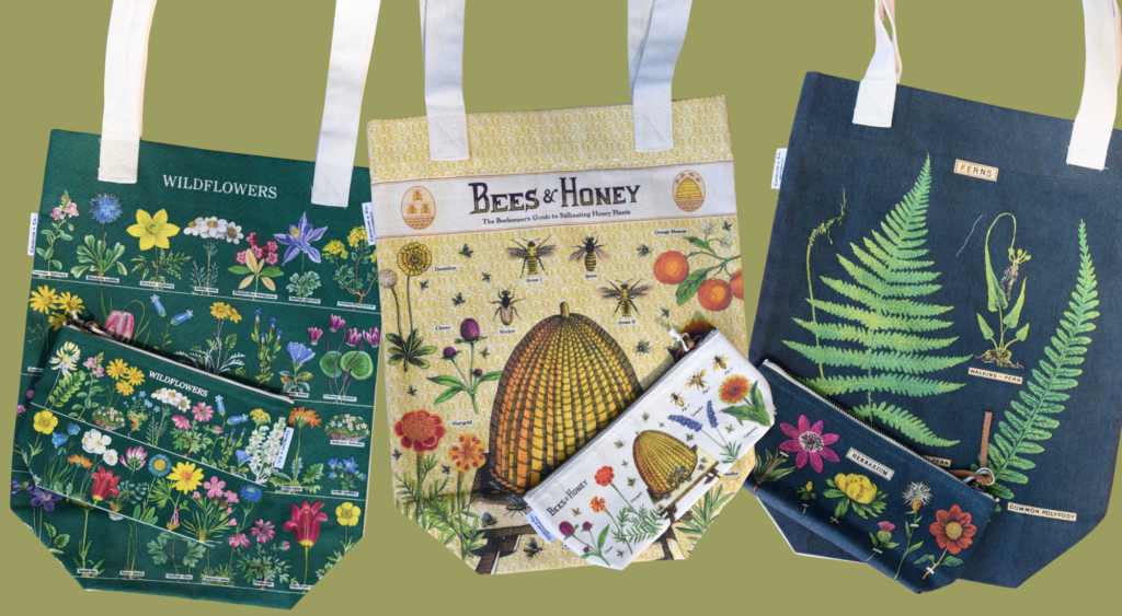 Three tote bags with botanical and bee-themed illustrations, each paired with a matching zippered pouch. Designs feature wildflowers, bees with a hive, and detailed ferns, all on a green background.